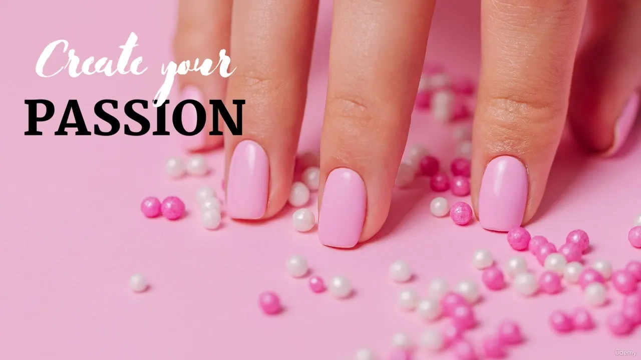 Close-up of a hand with glossy pink gel nails resting on a pink surface scattered with small pink and white beads.